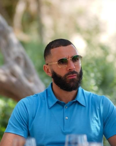 Karim Benzema Showcasing Style In A Sleek Blue Polo Shirt