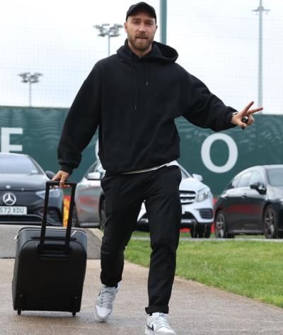 Christian Eriksen Exudes Style With Sleek Black Ensemble And Bag.