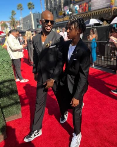 Chris Paul And Child Coordinate In Stylish Black Ensembles At Event