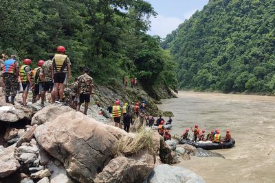 Nepal authorities say 65 people were on board the buses missing in a river since Friday