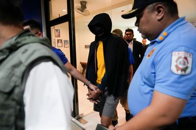 Philippine officials say suspect in the killings of 2 Australians and a Filipina has surrendered