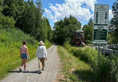 Hikers and cyclists can now cross Vermont on New England's longest rail trail, a year after floods