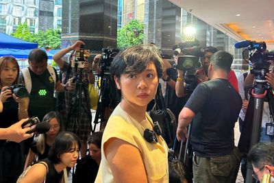 The head of Hong Kong's leading journalist group says she lost WSJ job after refusing to drop role