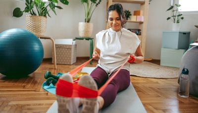 Why resistance bands are better than dumbbells for working out at home, according to a Pilates instructor