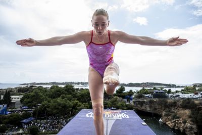 A cliff diver hilariously (and impressively) reenacted Olympic sports as if they were on a diving board
