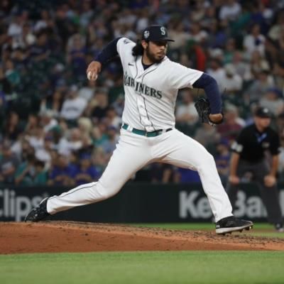 Andrés Muñoz Shines On The Baseball Field In White Uniform