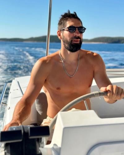 Nikola Karabatic's Stylish Boat Outing: Shirtless, Silver Chain, Black Shades