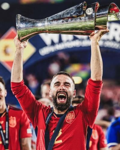 Dani Carvajal Celebrates Victory With Trophy In Hand