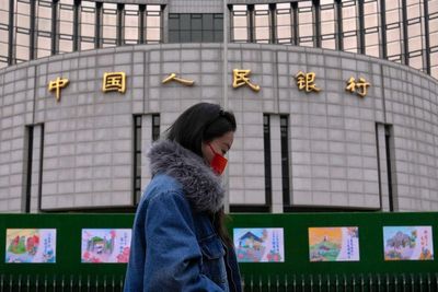 China's central bank cuts interest rates, moving to put more pep into the economy