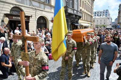 Thousands in Ukraine attend funeral of former lawmaker and critic of Russia who was killed in Lviv