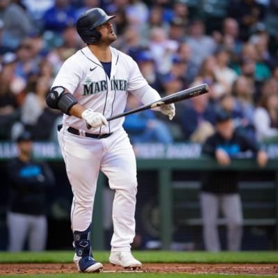 Mike Ford Showcasing Skills In White Baseball Uniform During Match