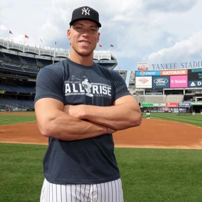 Aaron Judge's Stylish Outfit: Grey Tee, White Striped Pants