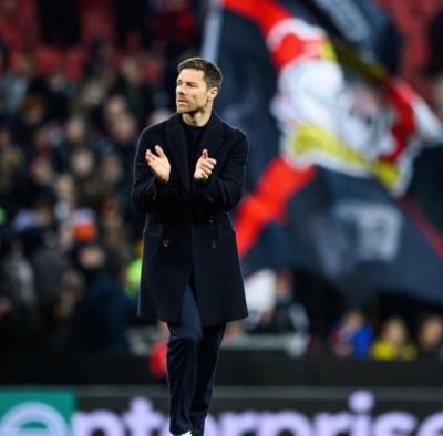 Xabi Alonso Showcasing Style On The Football Field In Black Coat