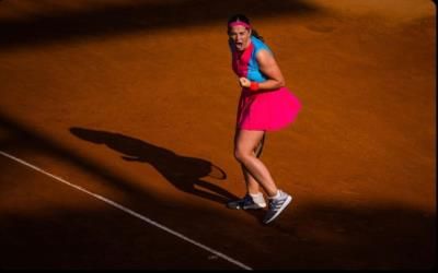 Jelena Ostapenko Shines In Pink And Blue Tennis Outfit