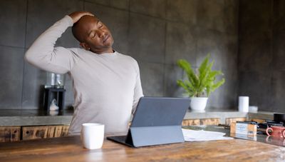 Stiff neck? This yoga teacher's five stretches will help ease tension and release stress—and you can do them at your desk