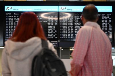 Flights suspended after climate protesters glue themselves to runway at busy airport