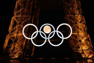 This photo of the Eiffel Tower, the moon and the Olympic rings is perfect