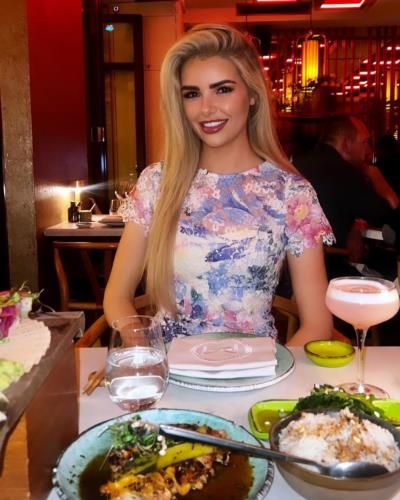 Ivanna Mcmahon Showcasing Floral Top At Elegant Dinner Setting