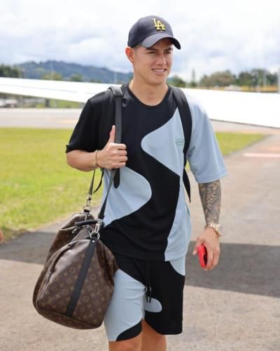 James Rodríguez Sporting Stylish Black And Grey Ensemble With Brown Bag