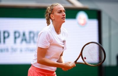 Professional Tennis Player Petra Kvitova Competing In Intense Match