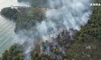 Tourists evacuated from Italian camping village as wildfire spreads