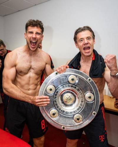 Leon Goretzka Celebrates Victory With Friend And Trophy