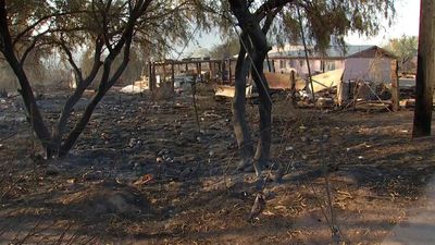 Suspect accused of lighting American flag on fire that sparked a wildfire that destroyed 2,000 acres and 21 homes