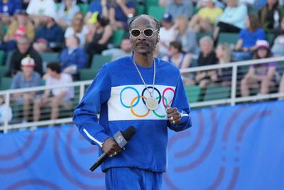 Why Snoop Dogg is back at the Olympics (and even carrying the Olympic torch)