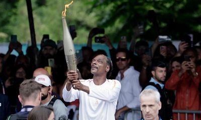 ‘It’s peanut butter and jelly’: Snoop Dogg embraces Olympic torch baton role