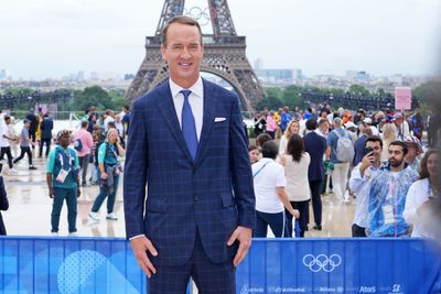 Peyton Manning hilariously used a quarterback wristband while calling the 2024 Paris Olympics opening ceremony