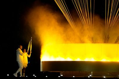 Olympic cauldron is lit by French gold medalists Teddy Riner and Marie-José Pérec
