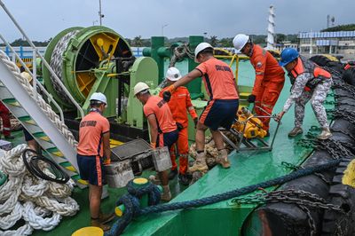 Philippines coastguard says oil leaking from capsized tanker