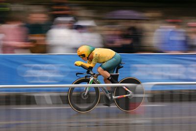 Grace Brown takes gold in rain-soaked women's Olympic time trial ahead of Anna Henderson