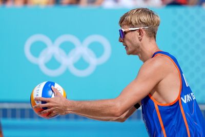 Dutch beach volleyball player who was convicted of rape is booed before losing first Olympic match