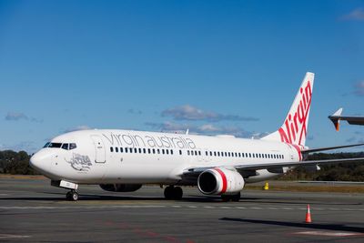 Passenger dies after collapsing on Virgin Australia flight