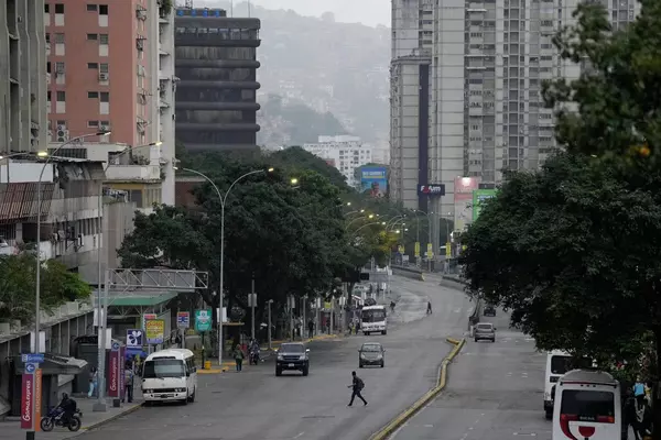 Normally bustling Venezuelan capital is unusually quiet after both sides claim victory in election