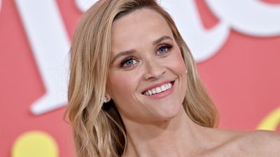 Reese Witherspoon's sweet white cardigan with gorgeous gold hoops is a classic pairing that'll never date