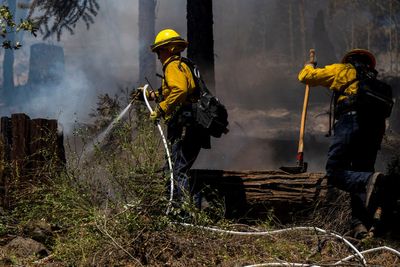 Firefighters make progress against massive blaze in California ahead of warming weather