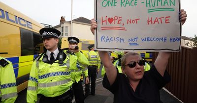 'Brave' campaigner praised for holding up powerful sign amid Southport riot