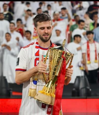 Miralem Pjanic Celebrates Soccer Victory With Golden Trophy And Medals