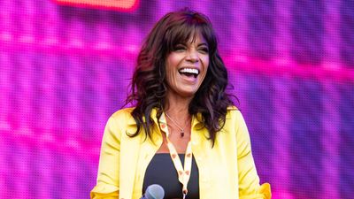 Jenny Powell just did yoga on the beach wearing a classic black bikini top teamed with the comfiest alternative to denim shorts