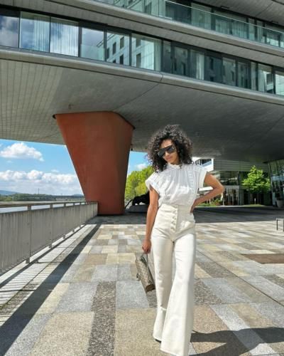 Stunning Style: Kedist Deltour's Elegant White Outfit Pose