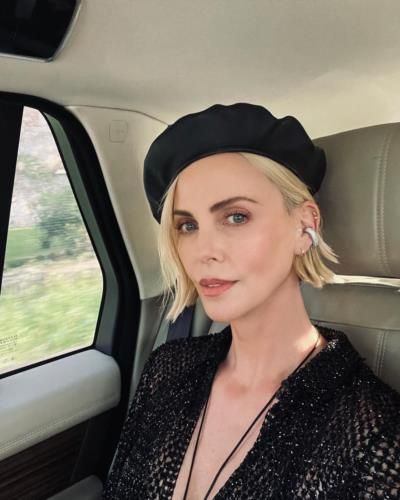 Charlize Theron Stuns In Stylish Black Outfit And Chic Hat