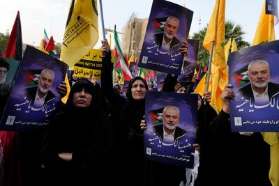 Iran’s supreme leader prays over the coffin of Hamas leader Haniyeh, whose killing risks a wider war