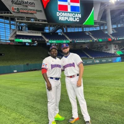 Celebrating Camaraderie: Luis Amado García And Teammate On The Field