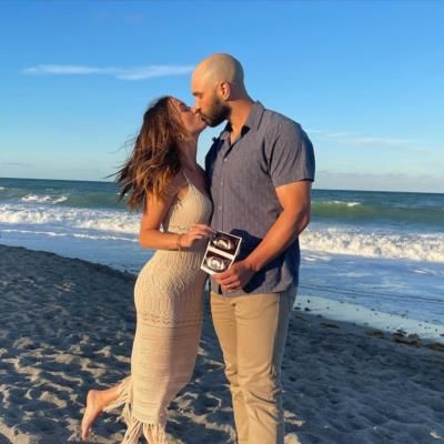 Romantic Beach Moment: Tanner Scott And Wife Share Loving Kiss