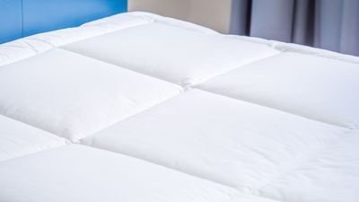 I bought a microfiber bed topper to soften up a firm mattress and it was a huge mistake — here's why