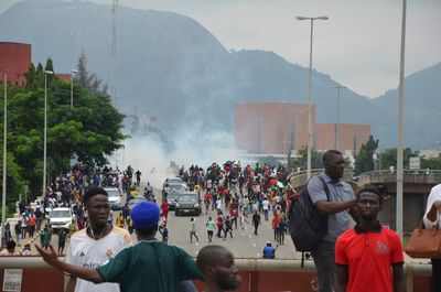 Rights group says 13 killed during protests over Nigeria's economic crisis. Hundreds arrested