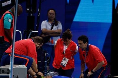 Slovakian swimmer collapses poolside after race at Paris Olympics