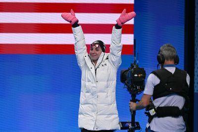 Why do swimmers wear parkas at the Olympics?